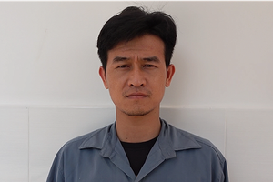 Đối tượng Nguyễn Thành Nguyễn tại cơ quan điều tra. (Ảnh: TTXVN phát)