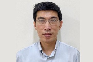 Ông Nguyễn Quang Linh thời điểm bị khởi tố. Ảnh: Bộ Công an.