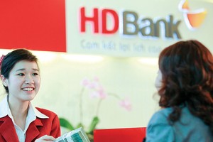 Năm 2017, các tổ chức tín dụng đã đáp ứng tốt nhu cầu tín dụng cho người mua nhà.  Ảnh: Lê Toàn