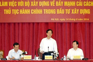Thủ tướng Chính phủ Nguyễn Tấn Dũng làm việc với Bộ Xây dựng - Ảnh: VGP