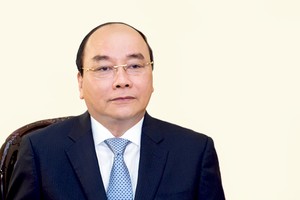 Thủ tướng Nguyễn Xuân Phúc trả lời phỏng vấn báo chí. Ảnh: VGP/Quang Hiếu