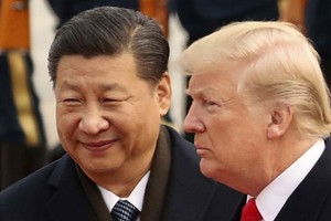 Tổng thống Mỹ Donald Trump (phải) và Chủ tịch Trung Quốc Tập Cận Bình trong cuộc gặp ở Bắc Kinh năm 2017. Ảnh:Reuters.