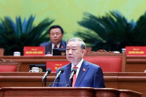 Tổng Bí thư Tô Lâm trình bày báo cáo về các văn kiện tại Đại hội XIV - Ảnh TTXVN .