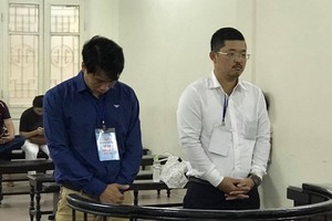 Bị cáo Nam và Thành tại tòa.