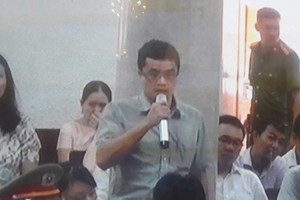 Ông Quang tại phiên tòa sơ thẩm.