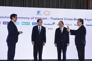 Chủ tịch nước Nguyễn Xuân Phúc và Bộ trưởng Bộ Tài chính Thái Lan chứng kiến Lễ công bố kết nối thanh toán bán lẻ ứng dụng mã phản hồi nhanh (QR code) giữa Việt Nam – Thái Lan