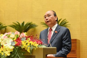 Thủ tướng Chính phủ Nguyễn Xuân Phúc báo cáo trước Quốc hội (Ảnh Duy Linh).