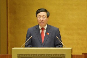 Phó thủ tướng Phạm Bình Minh báo cáo đánh giá kết quả thực hiện Kế hoạch phát triển kinh tế - xã hội 6 tháng đầu năm và các giải pháp 6 tháng cuối năm 2022.