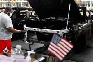 Giới phân tích cho rằng, để duy trì tốc độ tăng trưởng của năm 2021, Washington phải giải quyết được các chuỗi cung ứng đang bị tắc nghẽn và có giải pháp cho vấn đề Ukraine. Ảnh: AFP