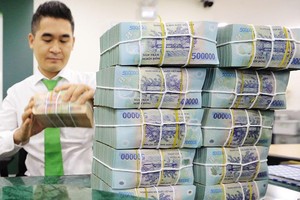 Nhiều khả năng NHNN vẫn chưa “xài” hết room tín dụng của cả năm là 14%. Ảnh: Đức Thanh