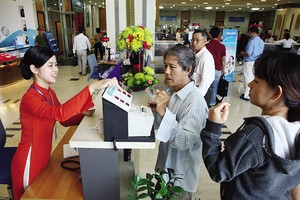 Tranh cãi về mức room ngoại tại Sacombank đến nay vẫn chưa ngã ngũ. Ảnh: Đức Thanh