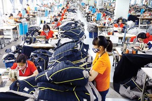 Doanh nghiệp dệt may đang rất khó khăn do đơn hàng xuất khẩu giảm mạnh Ảnh: Đức Thanh