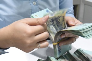 Trong bối cảnh khó khăn hiện tại, nguồn vốn là mối bận tâm lớn của các doanh nghiệp bất động sản. Ảnh: Dũng Minh 