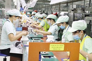 Đặc thù của Việt Nam là vốn đầu tư cho sản xuất, kinh doanh phụ thuộc rất lớn vào tín dụng. Ảnh: Đ.T