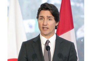 Thủ tướng Canada Justin Trudeau trong cuộc họp báo tại Ottawa. Ảnh: Kyodo/TTXVN