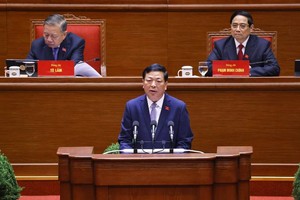 Bộ trưởng Bộ Xây dựng Trần Hồng Minh bày tham luận - Ảnh: TTXVN. 