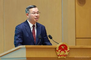 Bộ trưởng Bộ Tài chính Ngô Văn Tuấn trình bày Báo cáo trung tâm của Hội nghị - Ảnh: VGP