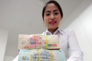Chênh lệch giữa tăng trưởng tín dụng và huy động vốn vẫn đặt ra yêu cầu cân đối thanh khoản và cơ cấu nguồn vốn với ngành ngân hàng