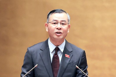 Bộ trưởng Bộ Tài chính Ngô Văn Tuấn trình bày tờ trình - Ảnh: Đức Thanh.