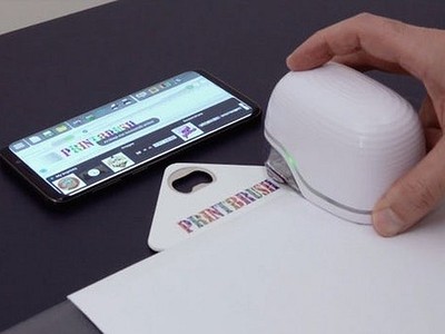 Máy in phun cầm tay chỉ to bằng con chuột máy tính