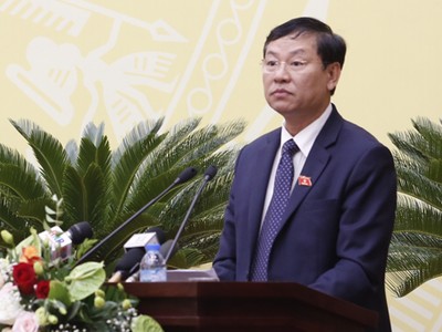 Chánh án Hà Nội Nguyễn Hữu Chính phát biểu tại phiên họp HĐND TP Hà Nội sáng 4/12. 