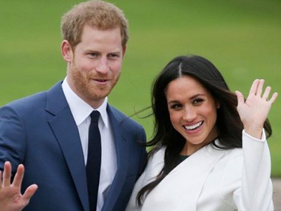 Hoàng tử Anh Harry và hôn thê Markle. Ảnh: AFP