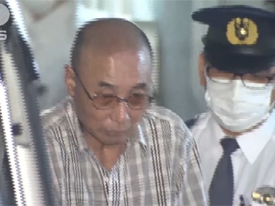 "Thánh móc túi" Kazutoshi Yamaguchi bị cảnh sát áp giải ở Tokyo hôm 21/5. Ảnh: ANN News