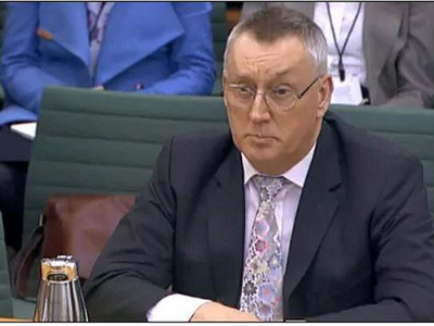 Giám đốc an ninh mạng của Huawei, John Suffolk, tại buổi điều trần trước quốc hội Anh. Ảnh: BBC.