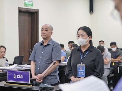 Các bị cáo Lương Thế Hiển và Nguyễn Thị Liên tại tòa.