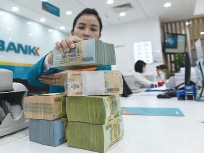 Nhiều ngân hàng chủ động tăng trích lập dự phòng để hạn chế rủi ro nợ xấu tăng. Ảnh: Dũng Minh