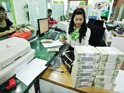 Lòng tin vào đồng Việt Nam được củng cố, tình trạng đô la hóa giảm mạnh - Ảnh: Hoài Nam