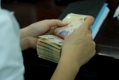 NHNN đã bơm vào hệ thống khoảng 180.000 tỷ đồng thông qua việc mua ngoại tệ, trong khi tính đến 22/7 hút ròng khoảng 116.000 tỷ đồng.