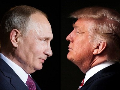 Tổng thống Nga Putin (trái) năm thứ 4 liên tiếp đứng đầu danh sách những người có ảnh hưởng nhất thế giới của Forbes, trong khi tổng thống đắc cử Mỹ tăng bậc từ 72 năm ngoái lên thứ hai năm nay. Ảnh: Reuters