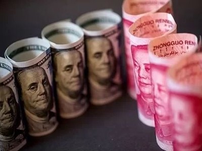 Đồng đôla Mỹ và nhân dân tệ Trung Quốc. Ảnh: Bloomberg