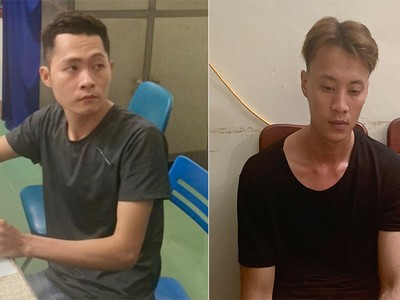 Nguyễn Thái Thành và Võ Hồng Quang tại cơ quan công an. Ảnh: Đại Hiệp.