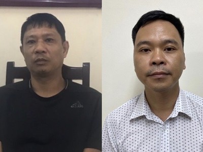 Bị can Bùi Quốc Việt (trái) và bị can Võ Việt Hùng. 