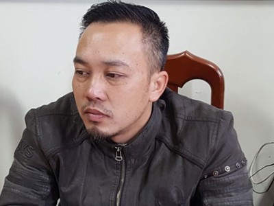 Nguyễn Đức Minh tại trụ sở công an.