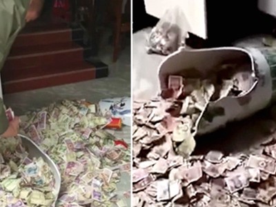 Ông bố giấu tiền trong chiếc bình suốt 13 năm. Ảnh: Press China.