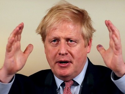 Johnson họp báo về Covid-19 tại Văn phòng Thủ tướng Anh hôm 12/3. Ảnh: Reuters.