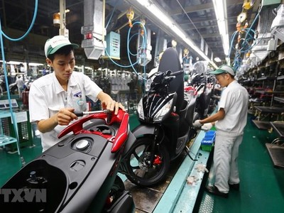 Dây chuyền lắp ráp xe gắn máy tại Công ty TNHH Honda Việt Nam, vốn đầu tư của Nhật Bản tại Vĩnh Phúc. (Ảnh: Danh Lam/TTXVN).