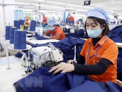 Sản xuất hàng dệt may. (Nguồn: TTXVN).