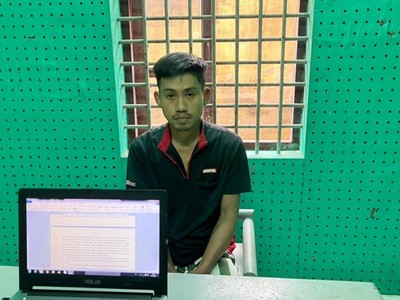 Phạm Ngọc Minh tại cơ quan công an.