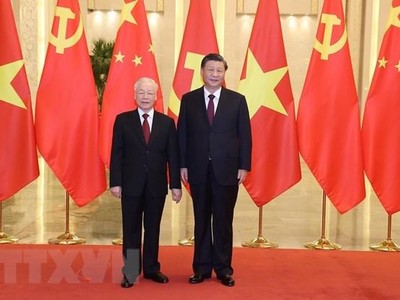 Tổng Bí thư Nguyễn Phú Trọng và Tổng Bí thư, Chủ tịch Trung Quốc Tập Cận Bình. (Ảnh: Trí Dũng/TTXVN).