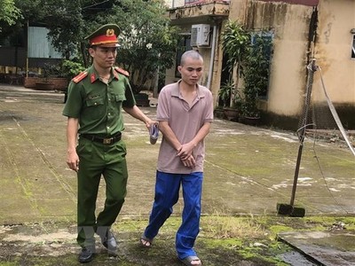 Đối tượng Ngô Trường Thịnh tại cơ quan công an. (Ảnh: TTXVN phát)