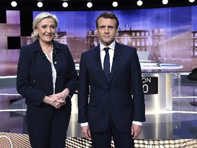 Marine Le Pen (trái) và Emmanuel Macron. Ảnh:Reuters