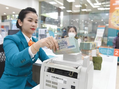 Các ngân hàng đang đẩy mạnh cho vay, nhưng lãi vay sẽ không tăng. Ảnh: Dũng Minh