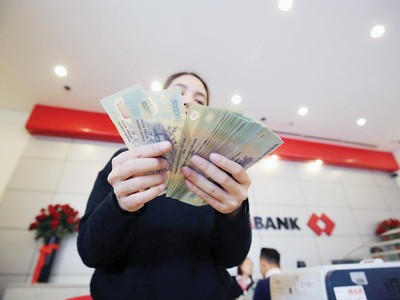 Theo lộ trình, tỷ lệ sử dụng vốn ngắn hạn cho vay trung, dài hạn sẽ về 34% từ đầu tháng 10/2022. Ảnh: Dũng Minh 