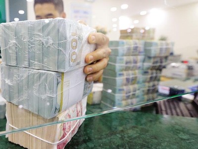 Nợ xấu có xu hướng tăng nhanh trong bối cảnh thanh khoản hạn chế đang khiến nhiều ngân hàng tăng tốc thu hồi công nợ và xử lý nợ xấu. Ảnh: Đức Thanh 