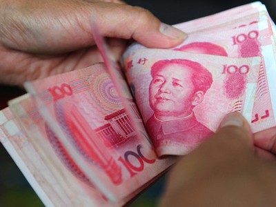 Đồng nhân dân tệ giao ngay mở cửa phiên giao dịch 13/2 ở mức 6,8349 CNY đổi 1 USD. Ảnh: AFP