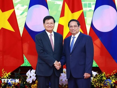 Thủ tướng Chính phủ Phạm Minh Chính hội kiến với Tổng Bí thư, Chủ tịch nước CHDCND Lào Thongloun Sisoulith. Ảnh: TTXVN